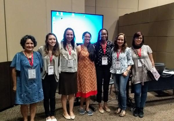 Nithila in the centre flanked by scholars who presented in a GEC session she chaired